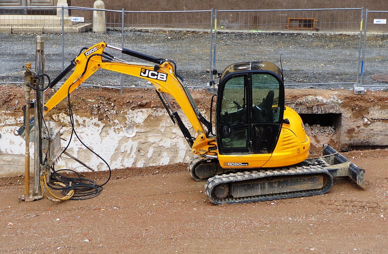 JCB 8050 compact excavator in a clay building excavation